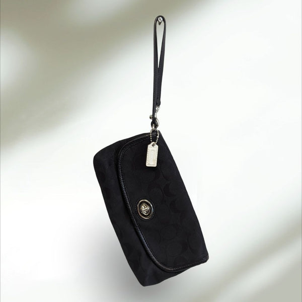 COACH Signature large flap Wristlet