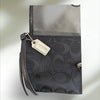 COACH Signature large flap Wristlet