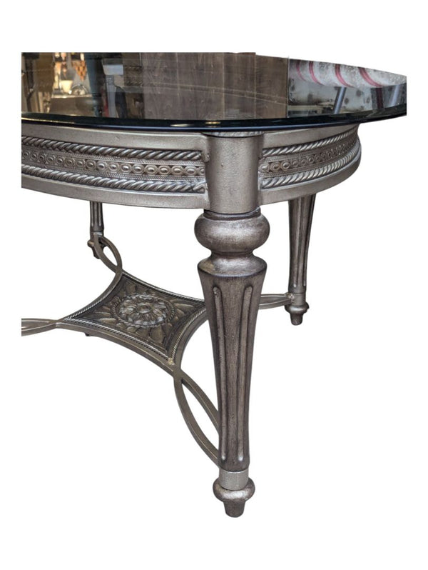Solid oval glass table with metal base