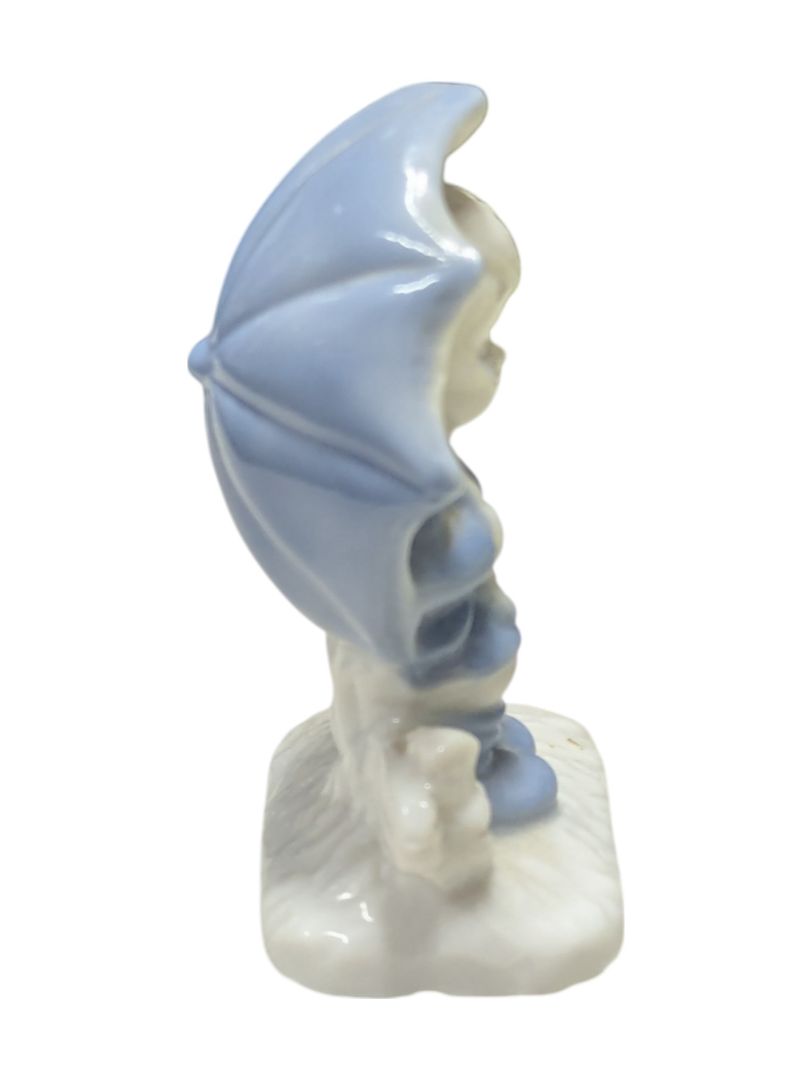 Kid w/ Umbrella Porcelain Figurine