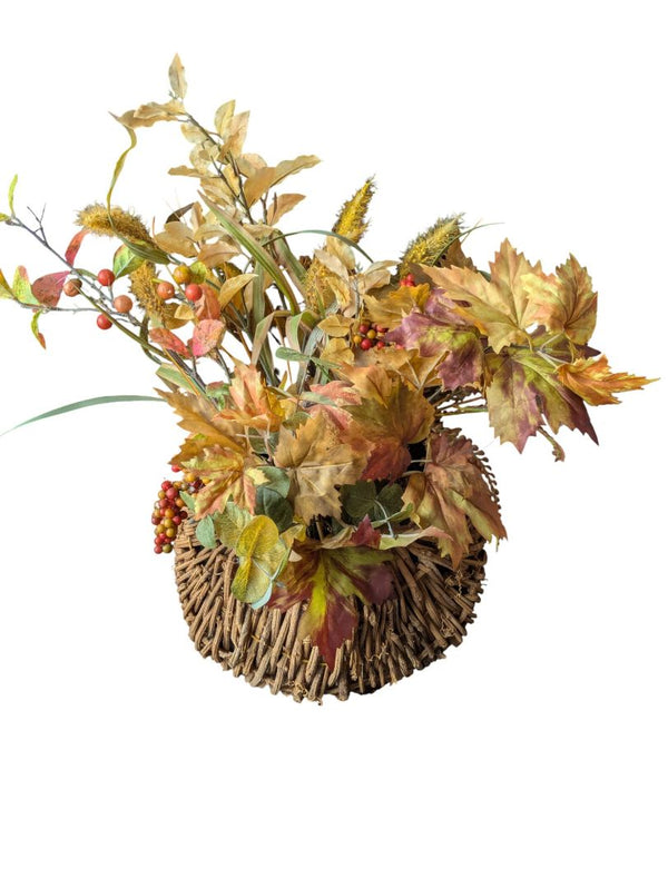 Artificial fall floral arrangements in wicker/rattan baskets