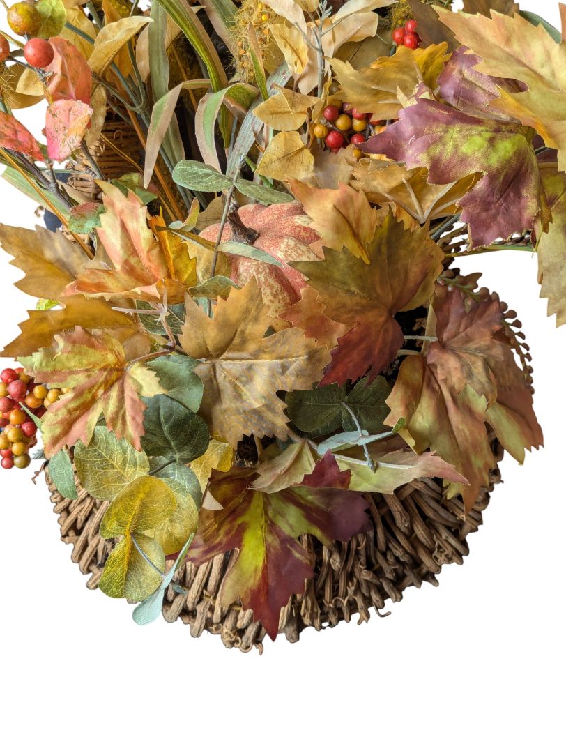 Artificial fall floral arrangements in wicker/rattan baskets