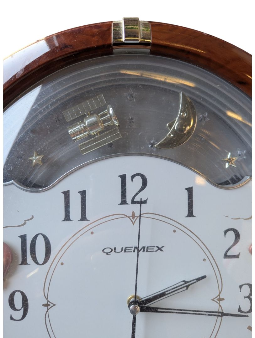 Quemex Quartz Animated Musical Wall Clock – Moon & Celestial Motion Display
