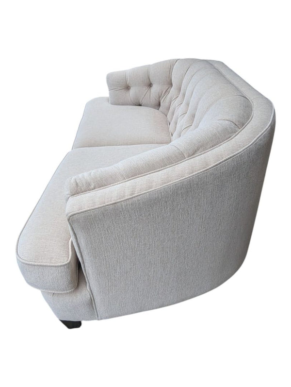 Cream Curved Tufted Sofa with Accent Pillows