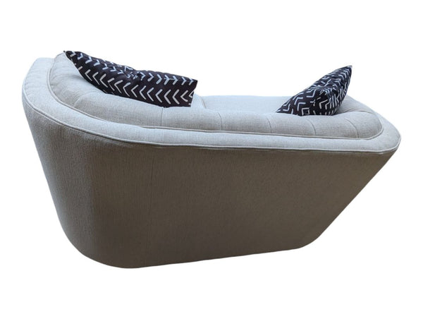 Cream Curved Tufted Sofa with Accent Pillows