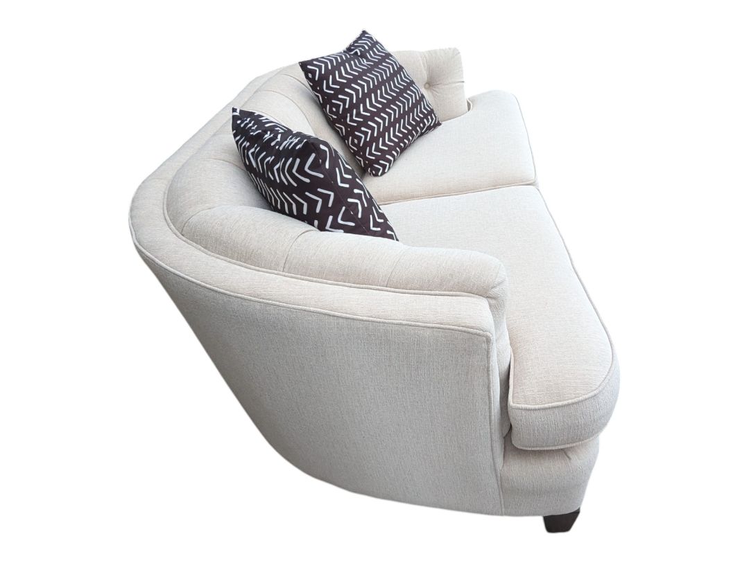 Cream Curved Tufted Sofa with Accent Pillows