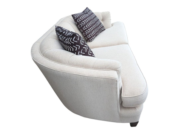 Cream Curved Tufted Sofa with Accent Pillows